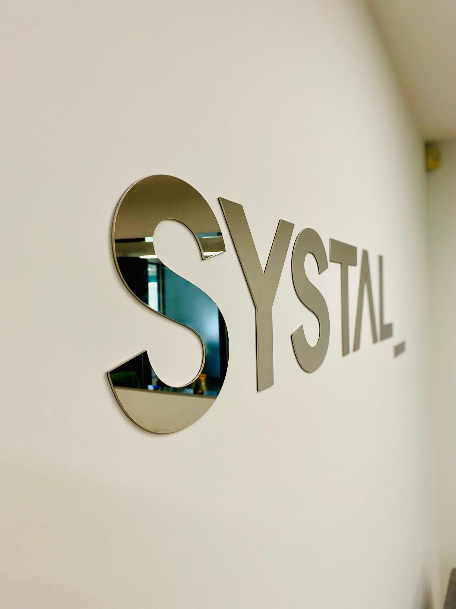 Striking Reception Signage: Mirrored Stainless Steel Logo Installation in Central London